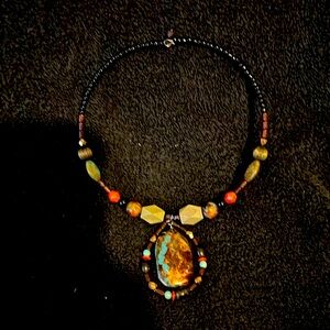 Beaded necklace with multiple shapes and designs of bee and stones